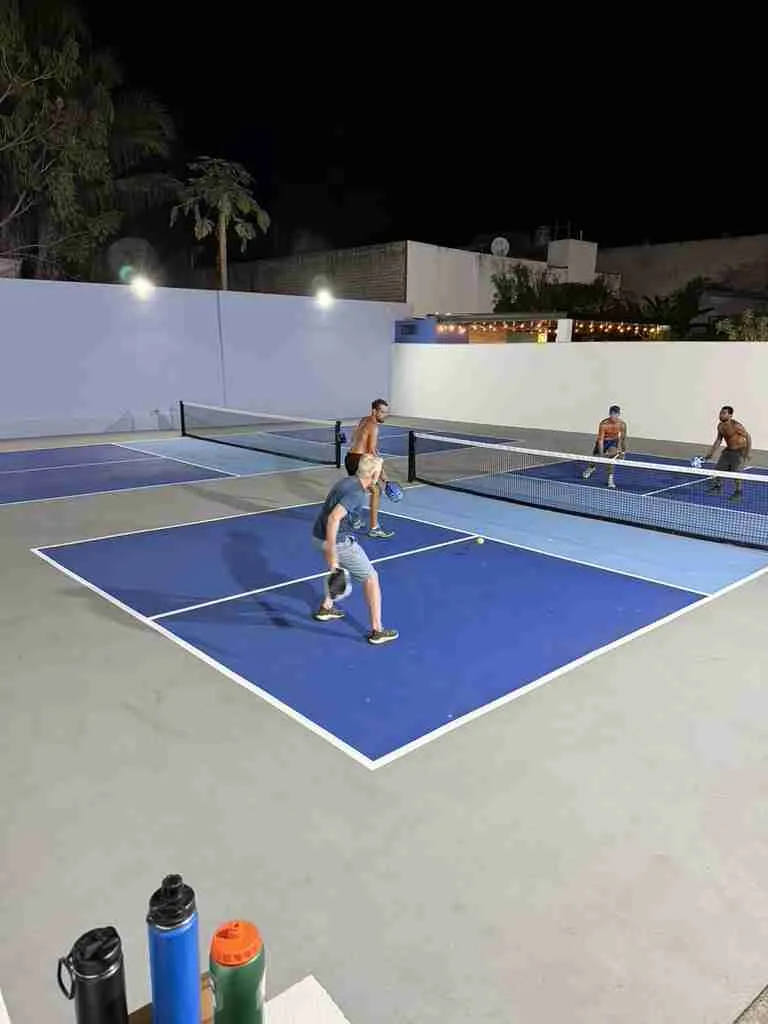 Nawalli courts under the lights at night
