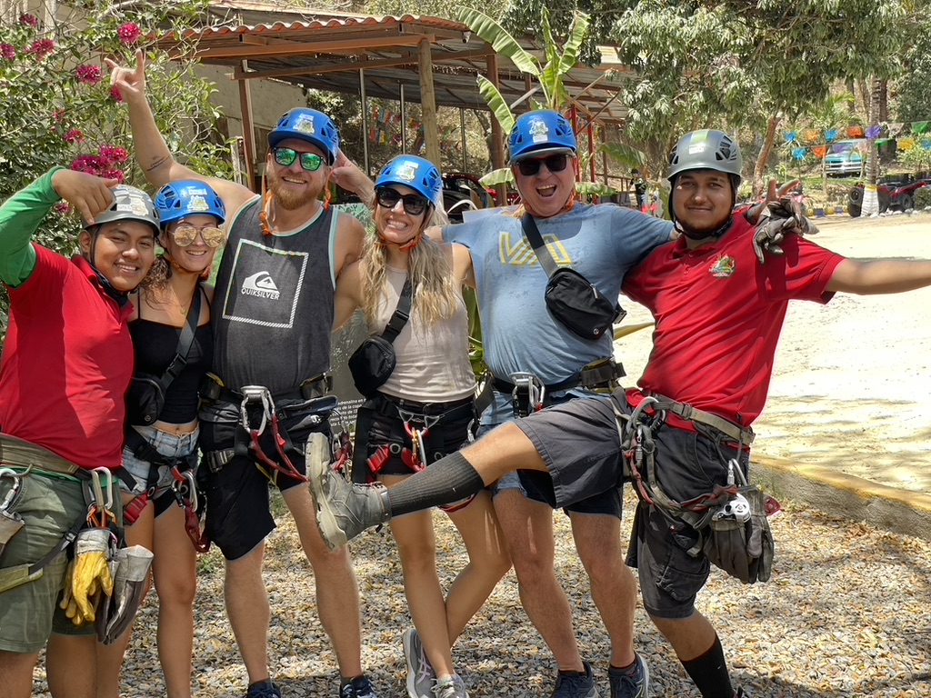 Group geared up for zip-lining through the jungle canopy